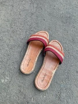 Central Java Indonesia October 8 2024: women's sandals on the asphalt. Fotos de archivo