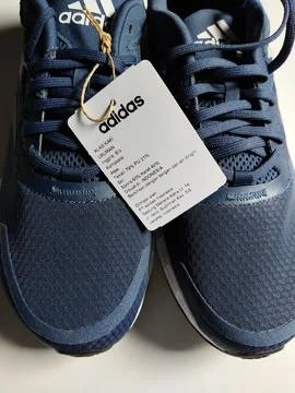 Central Java, Indonesia, September 11 2026: Brand new navy blue Adidas sneakers Stock Photos