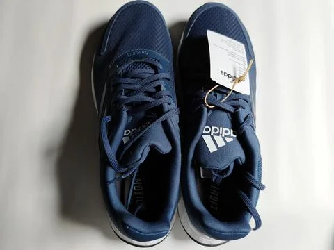 Central Java, Indonesia, September 11 2026: Brand new navy blue Adidas sneakers Stock Photos