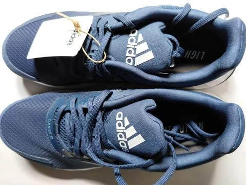 Central Java, Indonesia, September 11 2026: Brand new navy blue Adidas sneakers Stock Photos