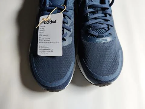 Central Java, Indonesia, September 11 2026: Brand new navy blue Adidas sneakers Stock Photos