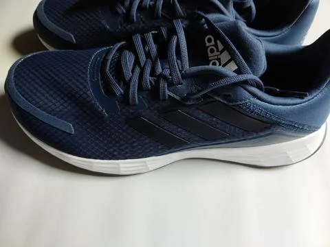 Central Java, Indonesia, September 11 2026: Brand new navy blue Adidas sneakers Stock Photos