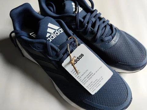 Central Java, Indonesia, September 11 2026: Brand new navy blue Adidas sneakers Stock Photos