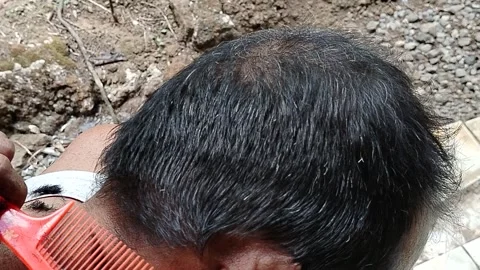 Central Java Indonesia September 12 2026: An Indonesian local man receives a cas Stock-Footage 345431525