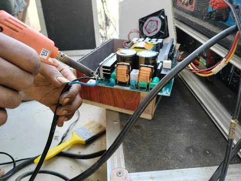 Central Java Indonesia September 5 2026: Close-up of a technician's hands using  Stock Photos