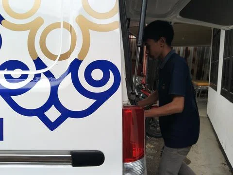 Central Java Indonesia September 7 2026: Close-up of a white operational van Stock Photos