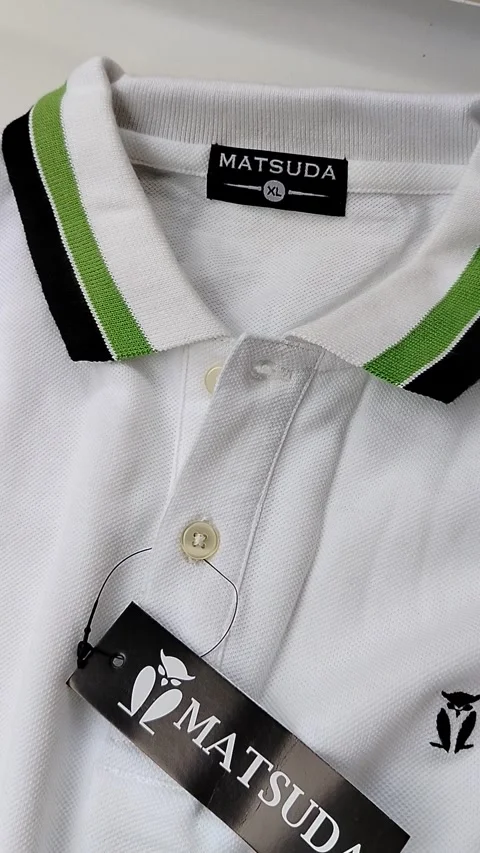 Central Java Indonesia15 July 2026: white polo shirt with a classic collar isola Video stock 340120199