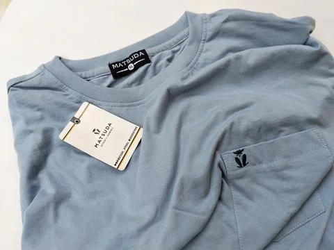 Central Java Indonesia15 July 2026: Light blue crew neck t-shirt with chest Stock-Fotos