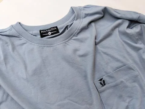 Central Java Indonesia15 July 2026: Light blue crew neck t-shirt with chest  Stock-Fotos