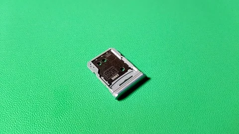 Central Java January 30, 2026: Hybrid slot sim card, smartphone. Stock Footage 328524513