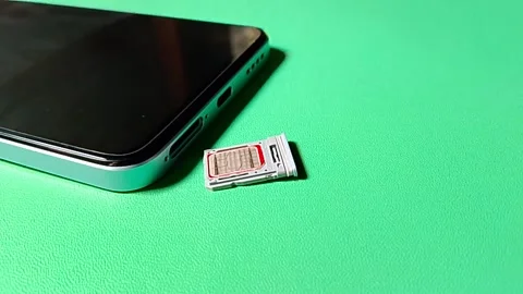 Central Java January 30, 2026: Hybrid slot sim card, smartphone. Stock Footage 328524515