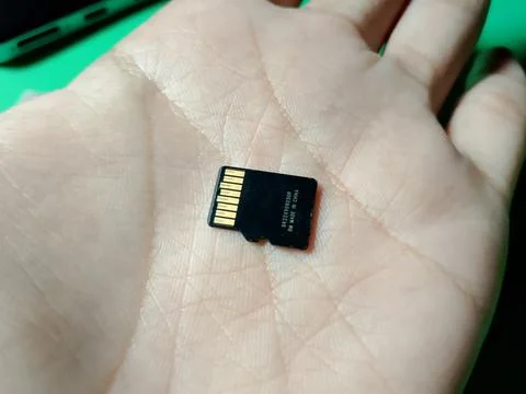 Central Java January 30, 2026: a holding Micro sd Sandisk, technology theme. Stock-Fotos