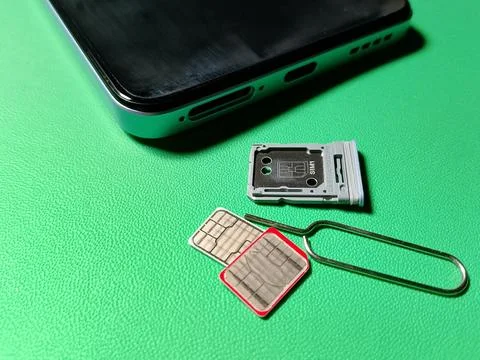 Central Java January 30, 2026: Hybrid slot sim card, sim ejector,smartphone. Stock-Fotos