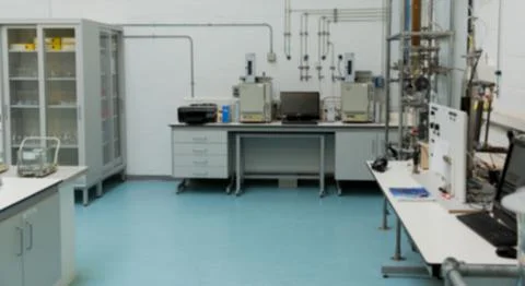 Central laboratory bench is being shown in flat design analytical lab with Stock Photos