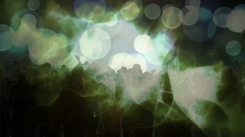Central light pulsing, shadowed crowd raising hands, lifting phones, reacting to Stock Footage 329700645
