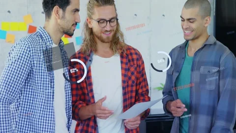 Central man picking up document, colleagues pointing pages and tapping tablet, Stock Footage 333019135