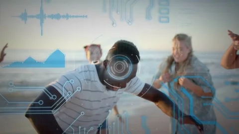 Central man stepping forward, initiating dance on beach, engaging group while AR Stock Footage 333734945