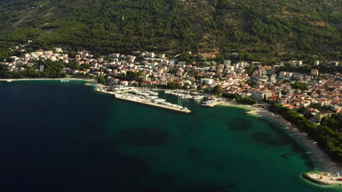 A central marina harbor docks yachts in the resort town of Baska Voda, Croatia Video stock 345726645