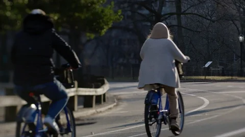 Central Park Cyclists at Sunrise Stock Footage 86219489