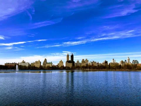 The Central Park West skyline reflected in the reservoir in New York City Stock Photos