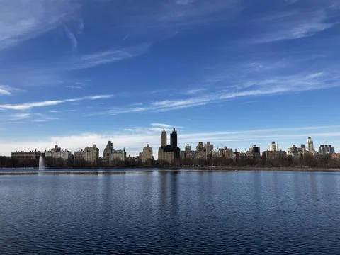 The Central Park West skyline reflected in the reservoir in New York City Stock Photos