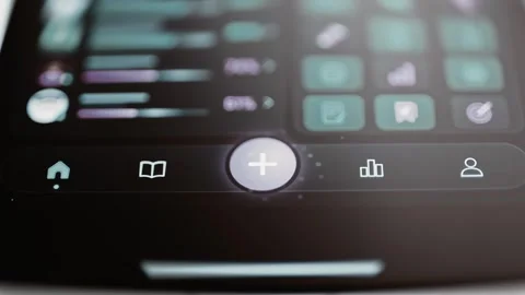 Central plus button rotates after a fingertip press Stock Footage 347586475