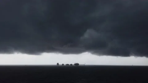 Central processing platform in the middle of the ocean on cloudy day Stock Footage 130478661