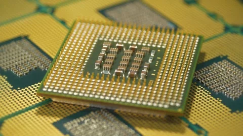 Central processing unit close up highlighting the intricate pin layout on chip Stock Footage 333574821