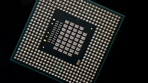 Central processing unit CPU microchip processor rotating on a dark background.4K Stock Footage 150826469