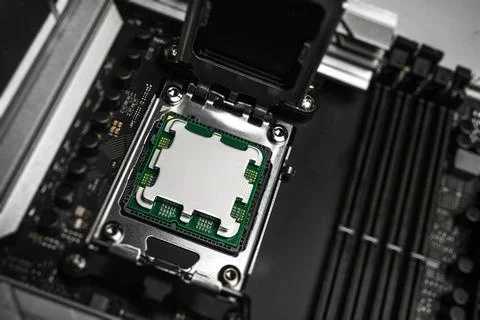 A central processing unit is securely seated in a motherboard socket Stock Photos