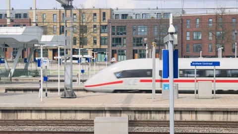 The central railway station with leaving ICE intercity train in Arnhem Stock Footage 333249846