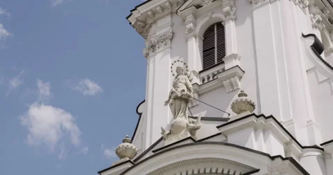 Central stone statue on the Basilica facade against a clear blue sky. Stock Footage 313834091