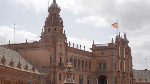 Central tower of Plaza de España building in Seville, Spain. Flag flying from Stock Footage 342303334