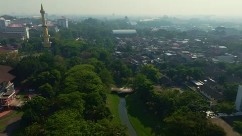 Central Yogyakarta park surrounded by expansive urban cityscape 動画素材 342580884