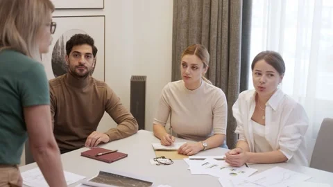 CEO discussing projects with colleagues at board meeting Video stock 218615471