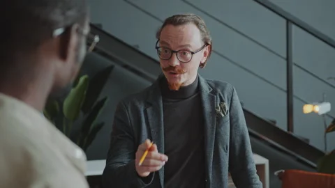 CEO Explaining Business Ideas to Colleagues during Office Meeting Stock Footage 281195690