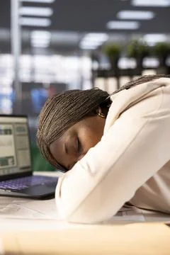 CEO falling asleep at work while using laptop Stock Photos