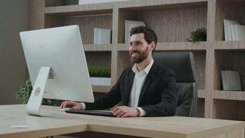 CEO smiling looking at his screen. Executive satisfied with the results in a Stock Footage 171249646