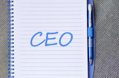 Ceo write on notebook Stock Photos