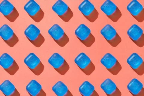 Ceometrical pattern from blue plastic cubes with shadows on a background in a Stock-Fotos