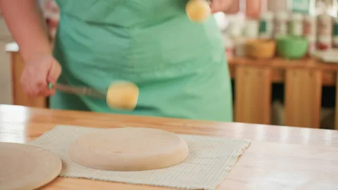 Ceramic artist shaping clay. Hands smoothing bisque with sponge tool. Artisan Stock Footage 342283349