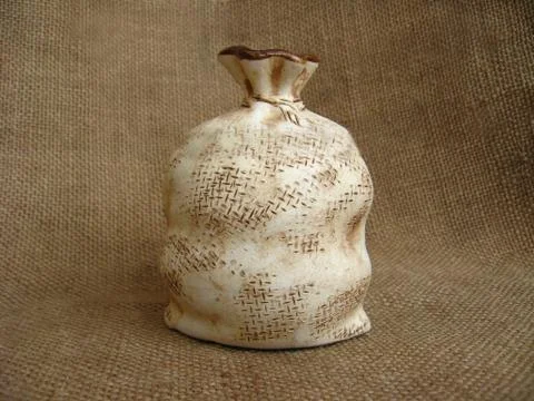 Ceramic bag on a brown background Stock Photos