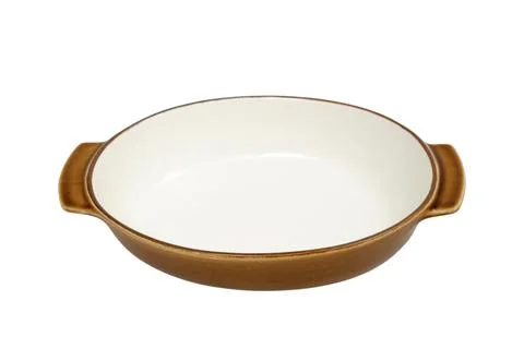 Ceramic baking dish with handle isolated on white background. Empty round c.. Photos