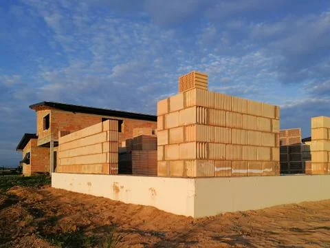 Ceramic block house under construction at evening Stock Photos