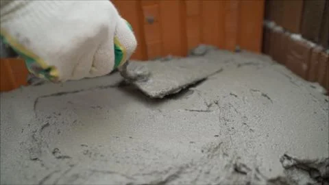Ceramic blocks. Worker puts a red ceramic block. Building a house from a red  Stock Photos