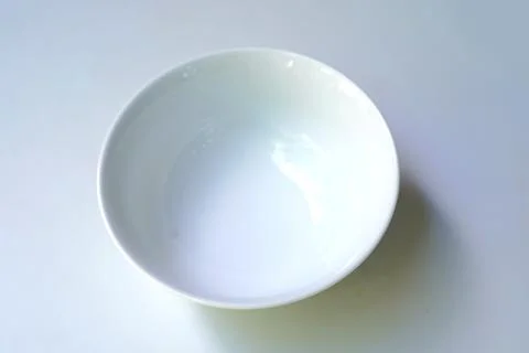 Ceramic bowl on blue background Stock Photos
