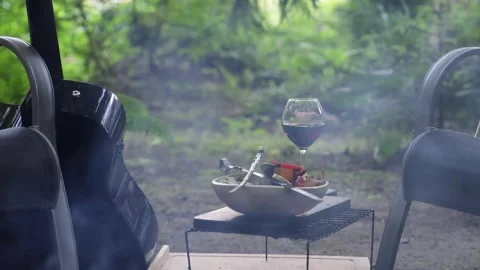 A ceramic bowl of vegetables stands by the fire Stock-Footage 277567885