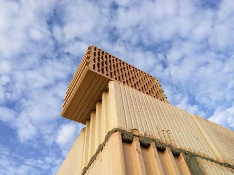 Ceramic building block close up in front of blue sky Stock Photos