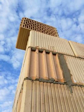 Ceramic building block close up in front of blue sky Stock Photos