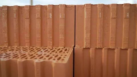 Ceramic building blocks stacked in a row. Ceramic blocks are in a row. Buildi Stockfoto's